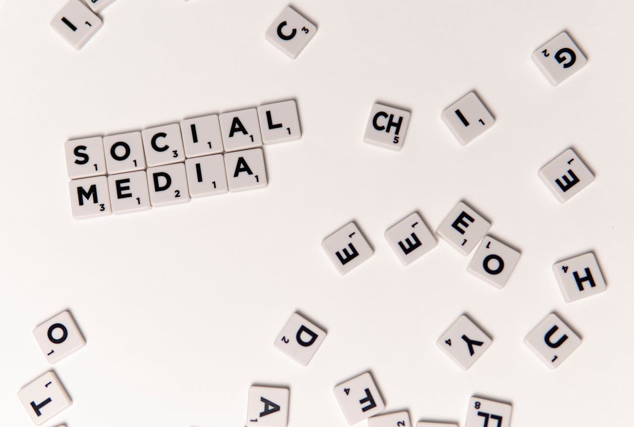 hero-img-01 Scrabble tiles spelling Social Media on a white background, symbolizing digital communication.